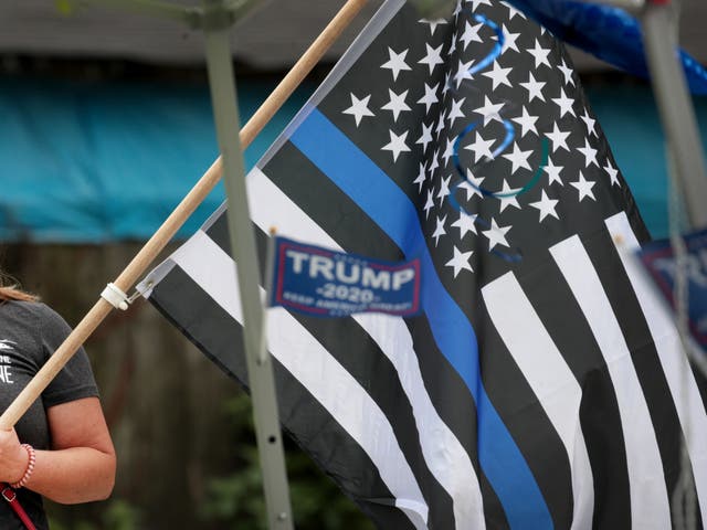 <p>A flag at a ‘Back the Blue’ rally near the Homan Square police station on August 15, 2020 in Chicago, Illinois</p>