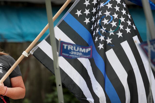 <p>A flag at a ‘Back the Blue’ rally near the Homan Square police station on August 15, 2020 in Chicago, Illinois</p>