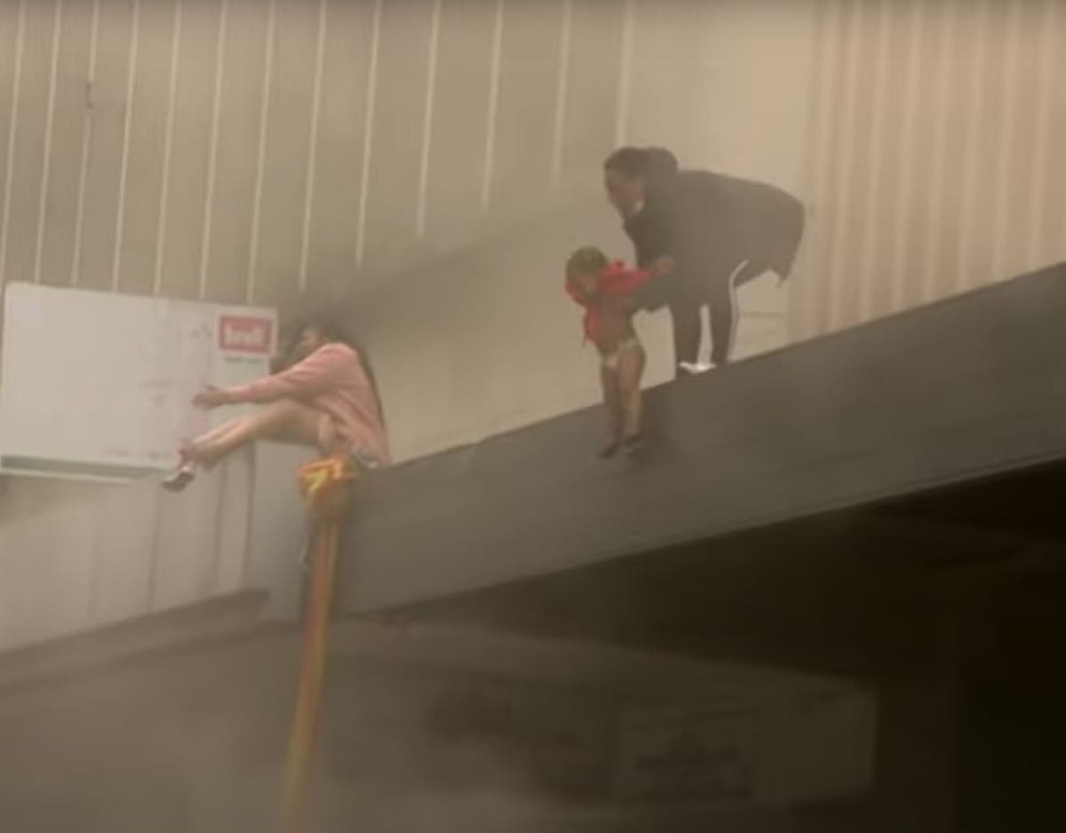 Toddler thrown from burning building in South Africa after looters