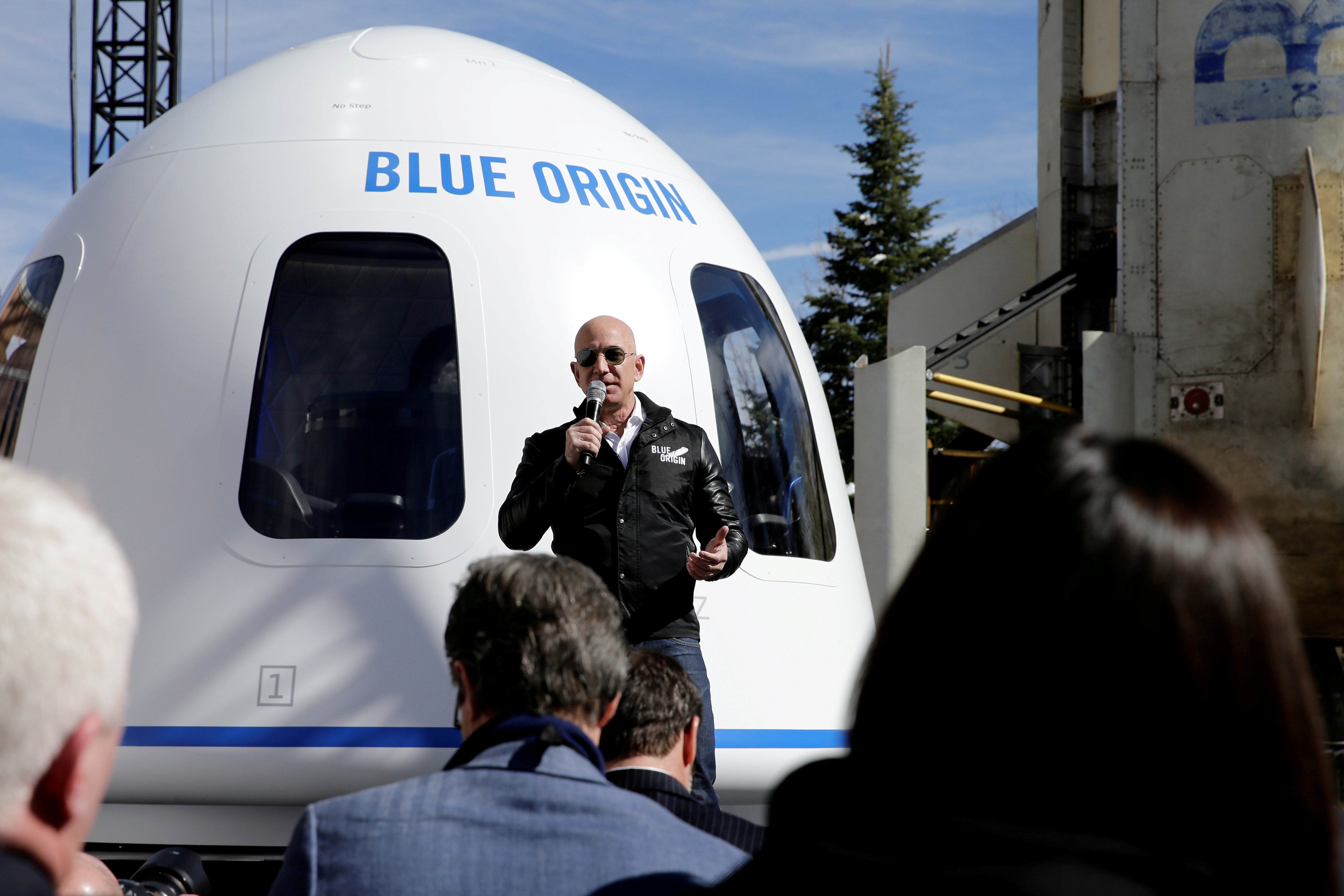 Amazon and Blue Origin founder Jeff Bezos addresses the media about the New Shepard rocket booster