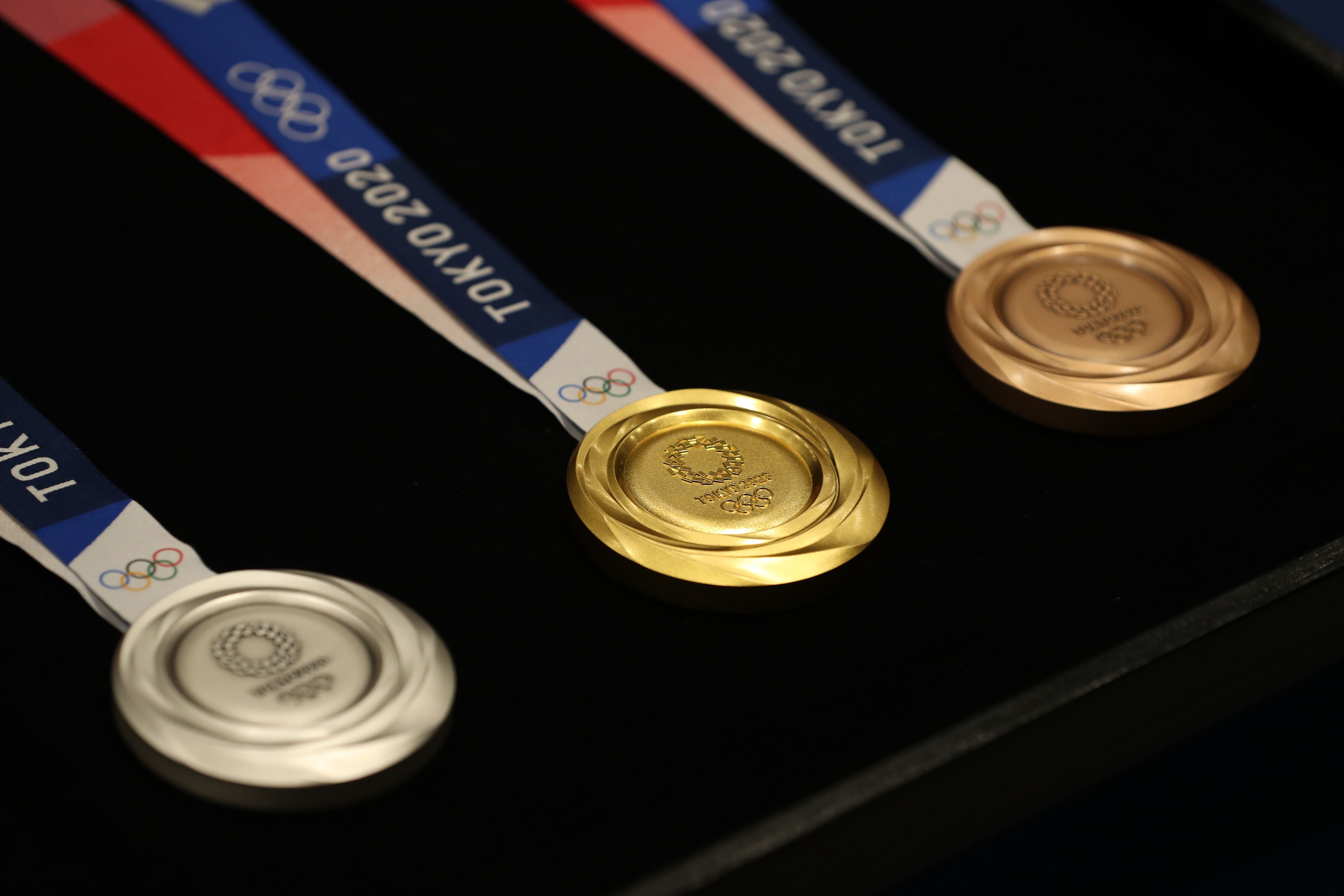 Olympic event winners will have to take medals from a tray and place them around their own necks
