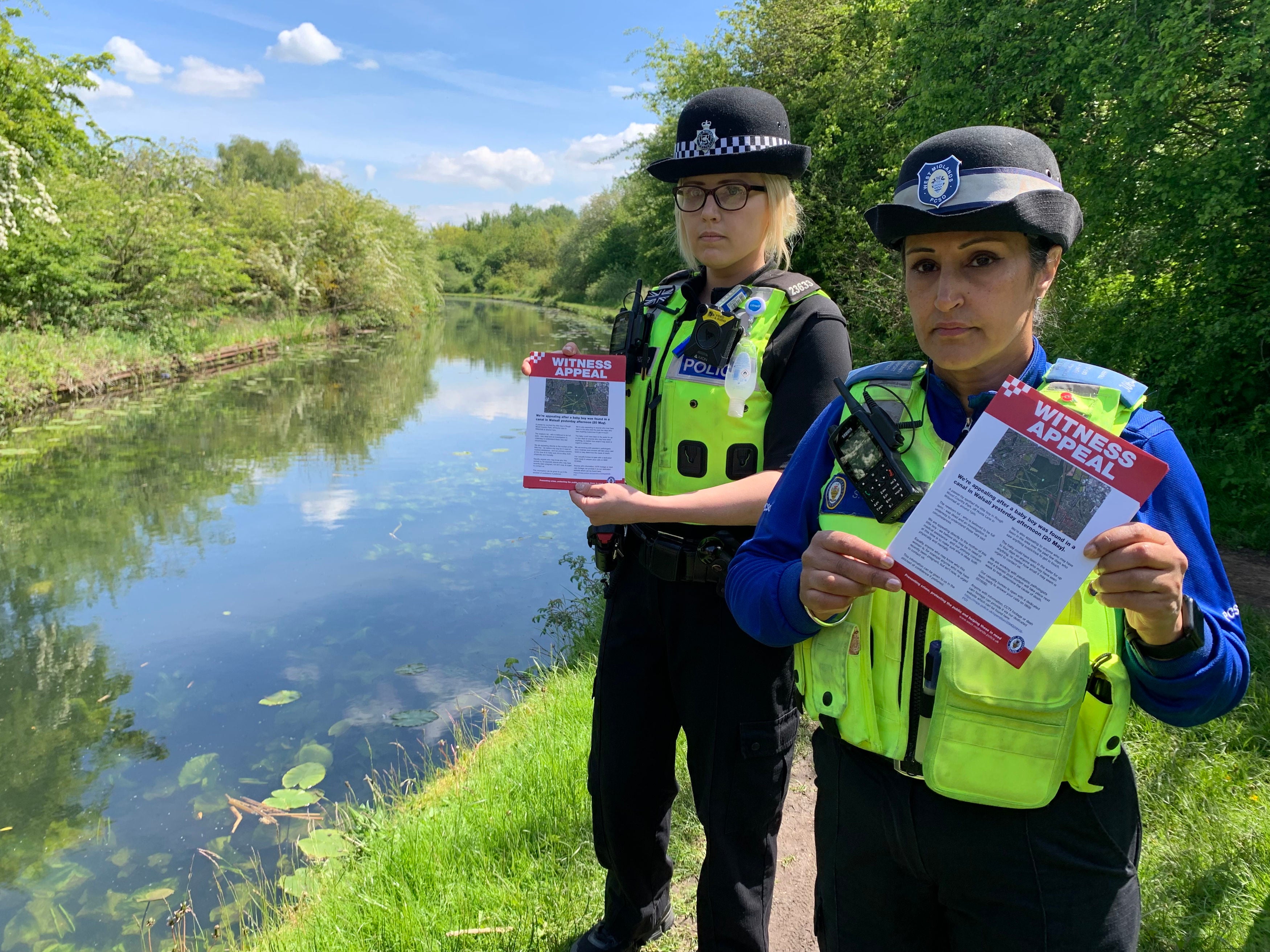 PC Charlotte Gardner and PCSO Suki Lally in Rough Wood country park in Walsall, who have been among officers leafleting the local area to raise awareness about the incident where a dead newborn baby boy was found in the local canal