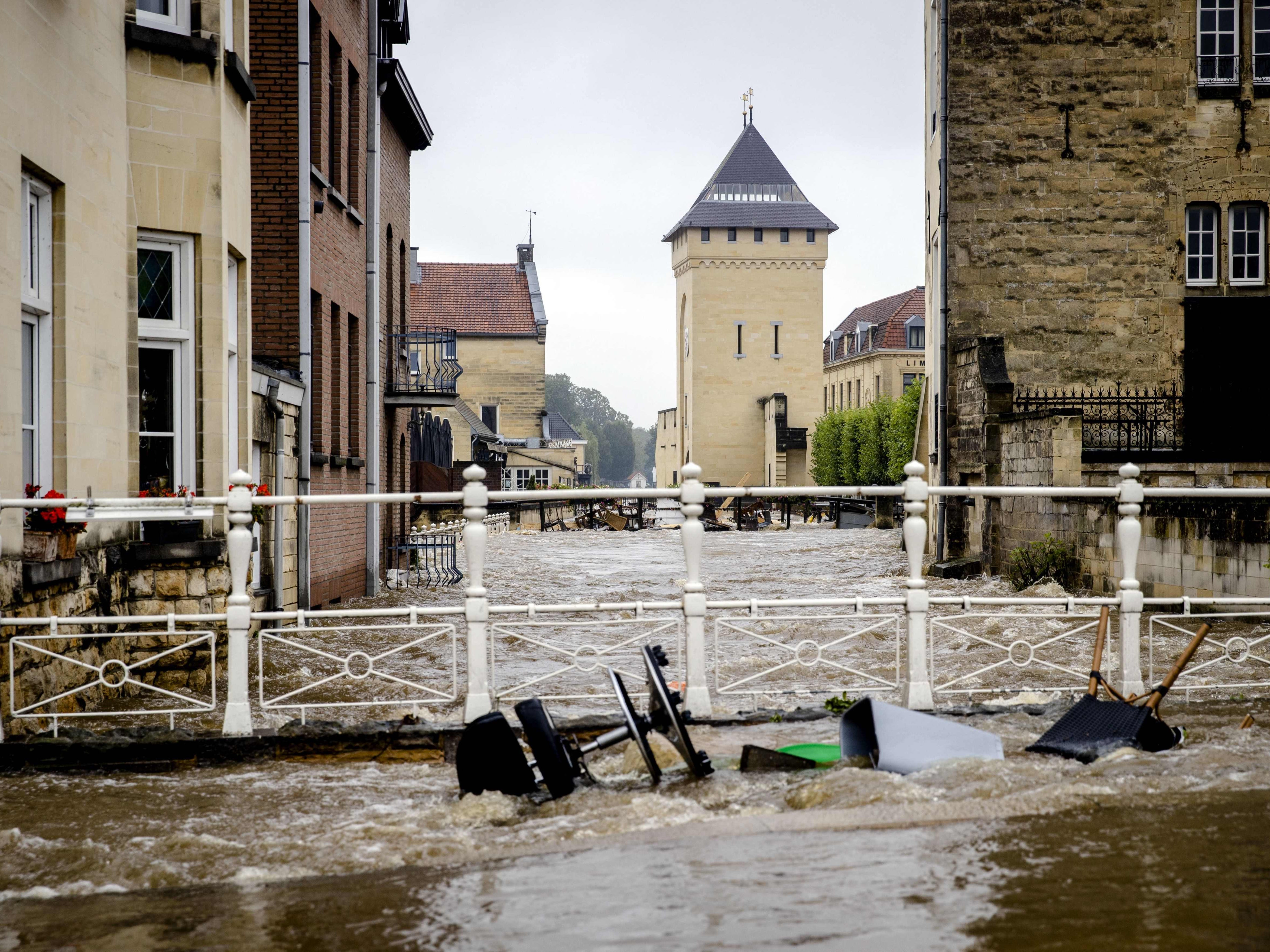 Flood waters rush through the centre of Valkenburg aan de Geul