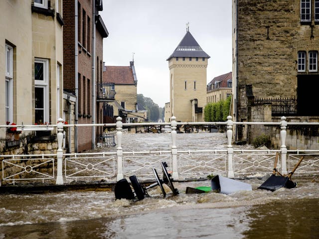 <p>Flood waters rush through the centre of Valkenburg aan de Geul </p>