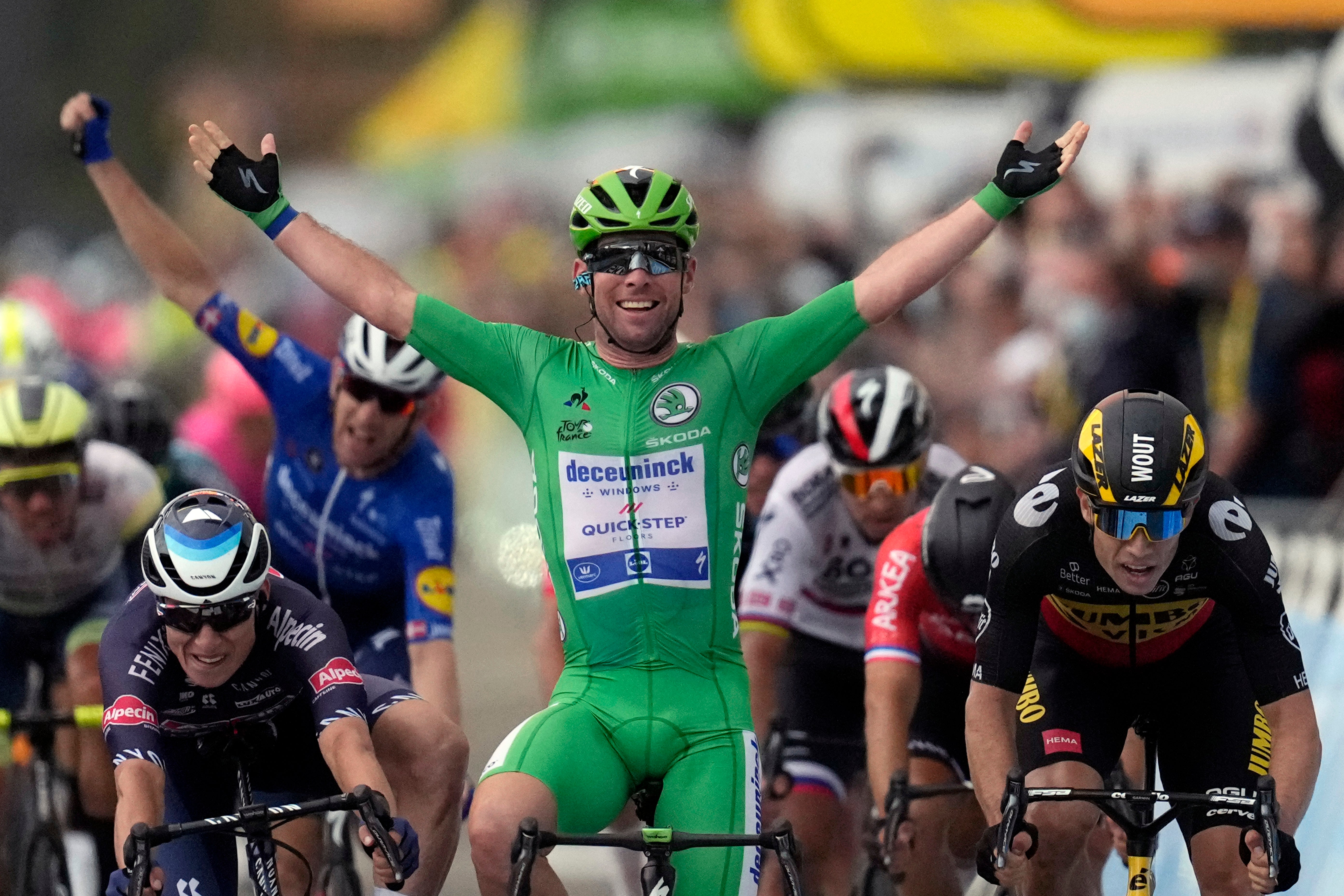 Cavendish wins stage 10 as Morkov, background, celebrates