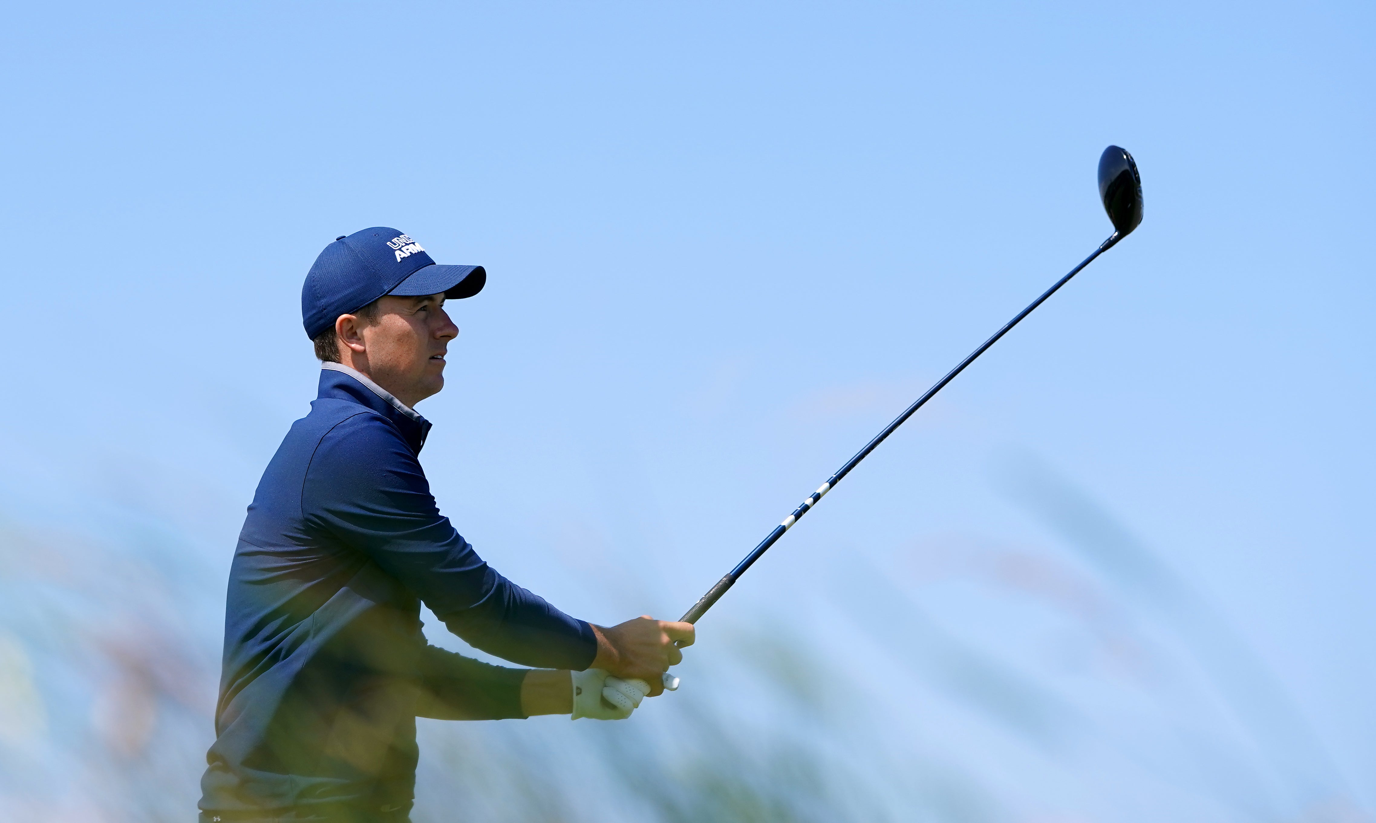 <p>Jordan Spieth tees off with his driver</p>