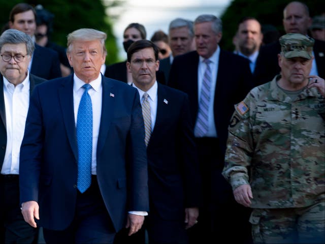 <p>Donald Trump walks with Chairman of the Joint Chiefs of Staff Mark Milley and others to visit St John’s Church on June 1, 2020, in Washington, DC.</p>