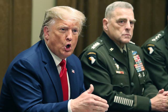 <p>U.S. President Donald Trump speaks as Joint Chiefs of Staff Chairman, Army General Mark Milley looks on after a briefing from senior military leaders in the Cabinet Room at the White House on October 7, 2019 in Washington, DC.</p>