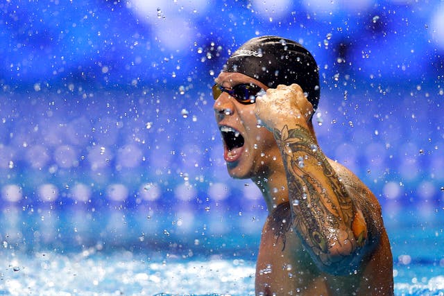 <p>Caeleb Dressel of the United States reacts after competing in the Men’s 100m freestyle final during Day Five of the 2021 U.S. Olympic Team Swimming Trials at CHI Health Center on June 17, 2021 in Omaha, Nebraska. </p>