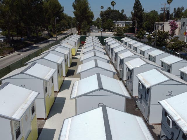 <p>A view of housing units at the Tarzana Tiny Home Village which offers temporary housing for homeless people, is seen on9 July 2021 in the Tarzana neighborhood of Los Angeles, California</p>