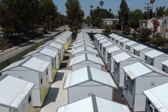 <p>A view of housing units at the Tarzana Tiny Home Village which offers temporary housing for homeless people, is seen on9 July 2021 in the Tarzana neighborhood of Los Angeles, California</p>