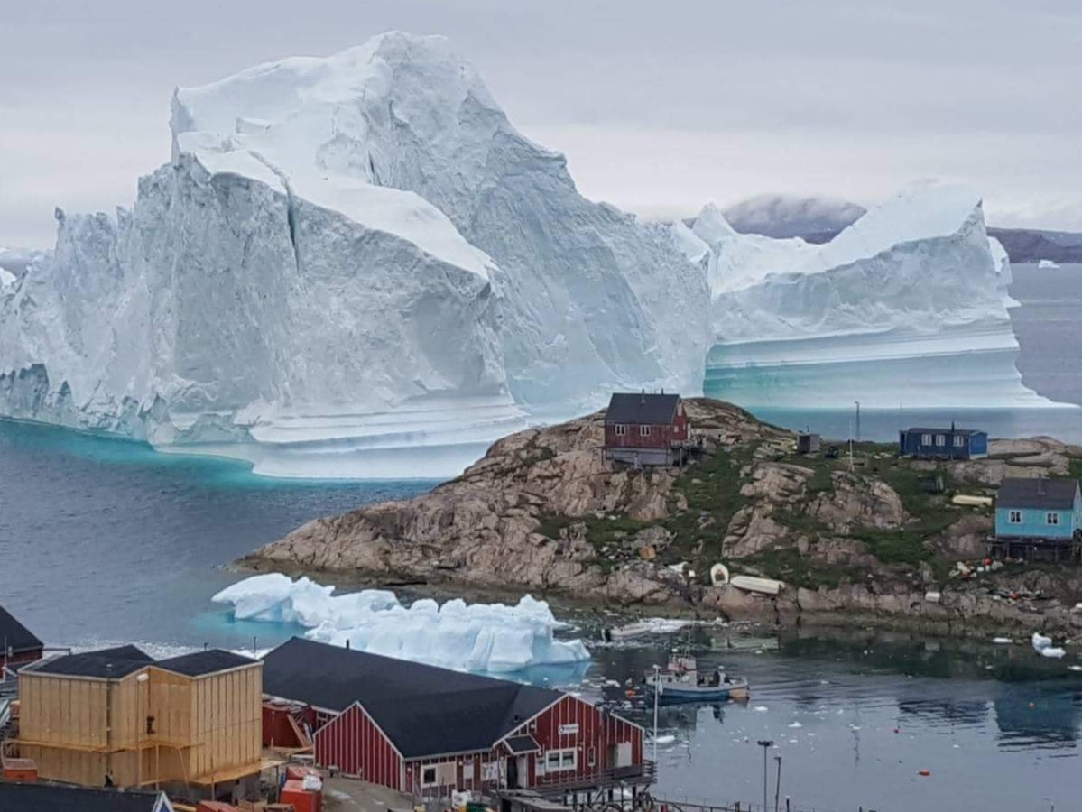 An iceberg grounds in north-western Greenland. Retreating ice could allow access to billions of gallons of oil