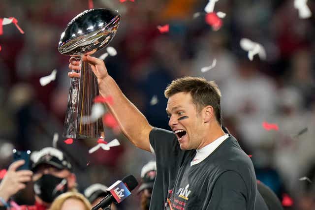 <p>File. In this 7 February 2021 photo, Tampa Bay Buccaneers quarterback Tom Brady celebrates with the Vince Lombardi Trophy after the team's NFL Super Bowl 55 football game against the Kansas City Chiefs </p>