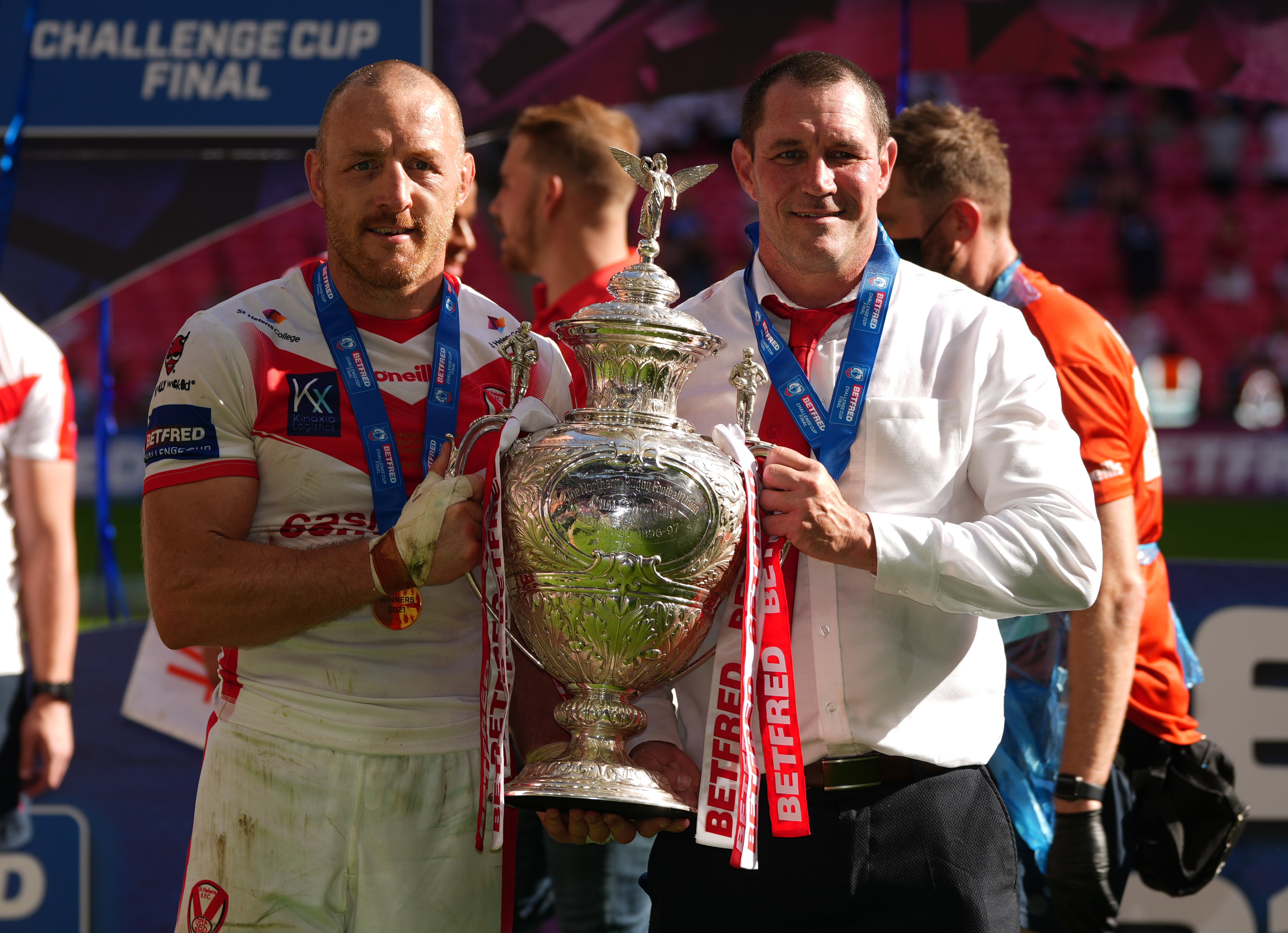 St Helens’ James Roby (left) and head coach Kristian Woolf celebrate with the Challenge Cup trophy