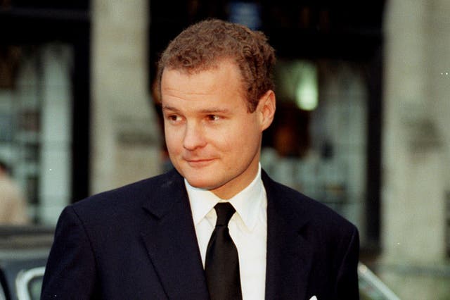 <p>Harmsworth at Westminster Abbey in 1998, following the memorial service for his father</p>