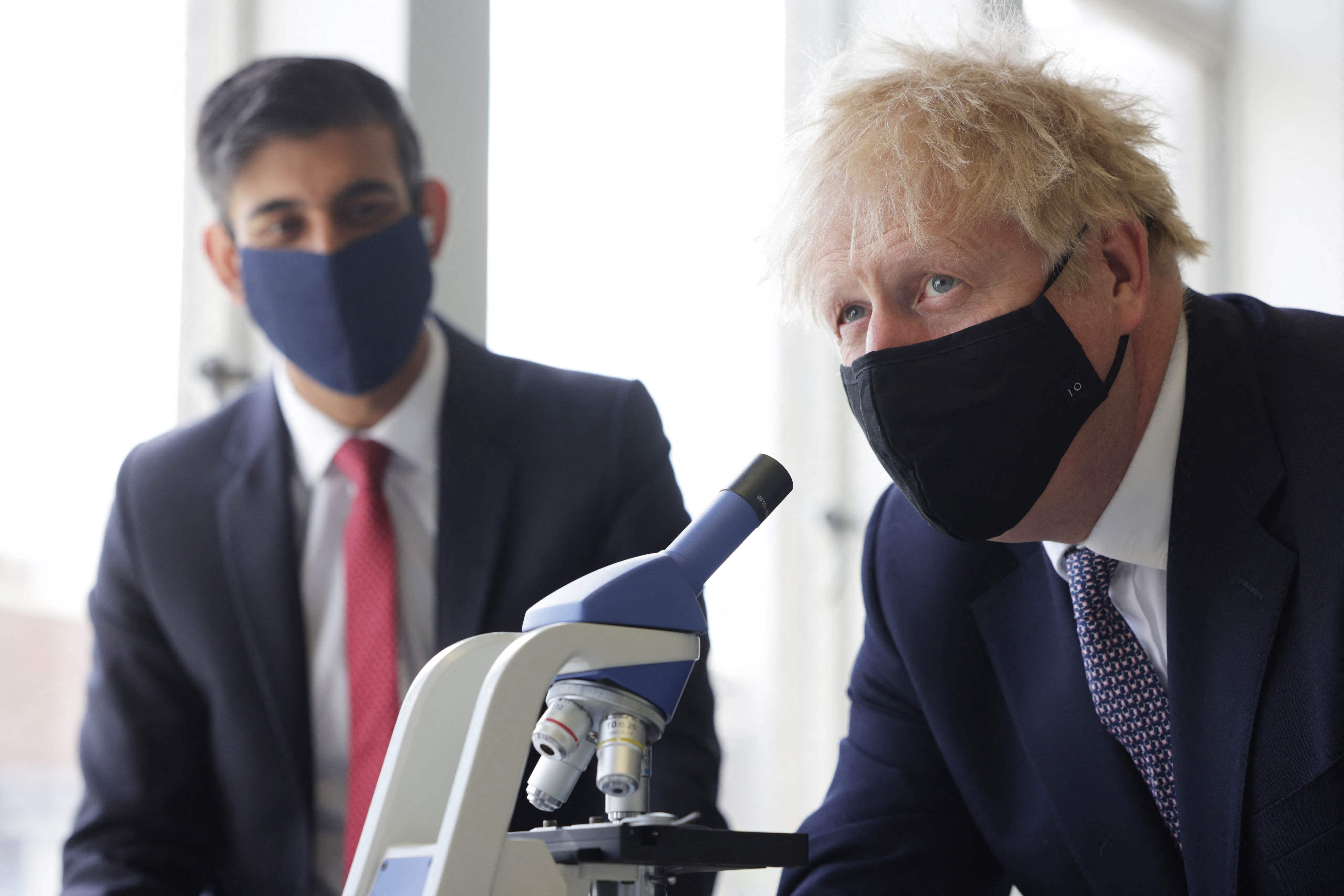 Rishi Sunak, left, and Boris Johnson, looking for the answer