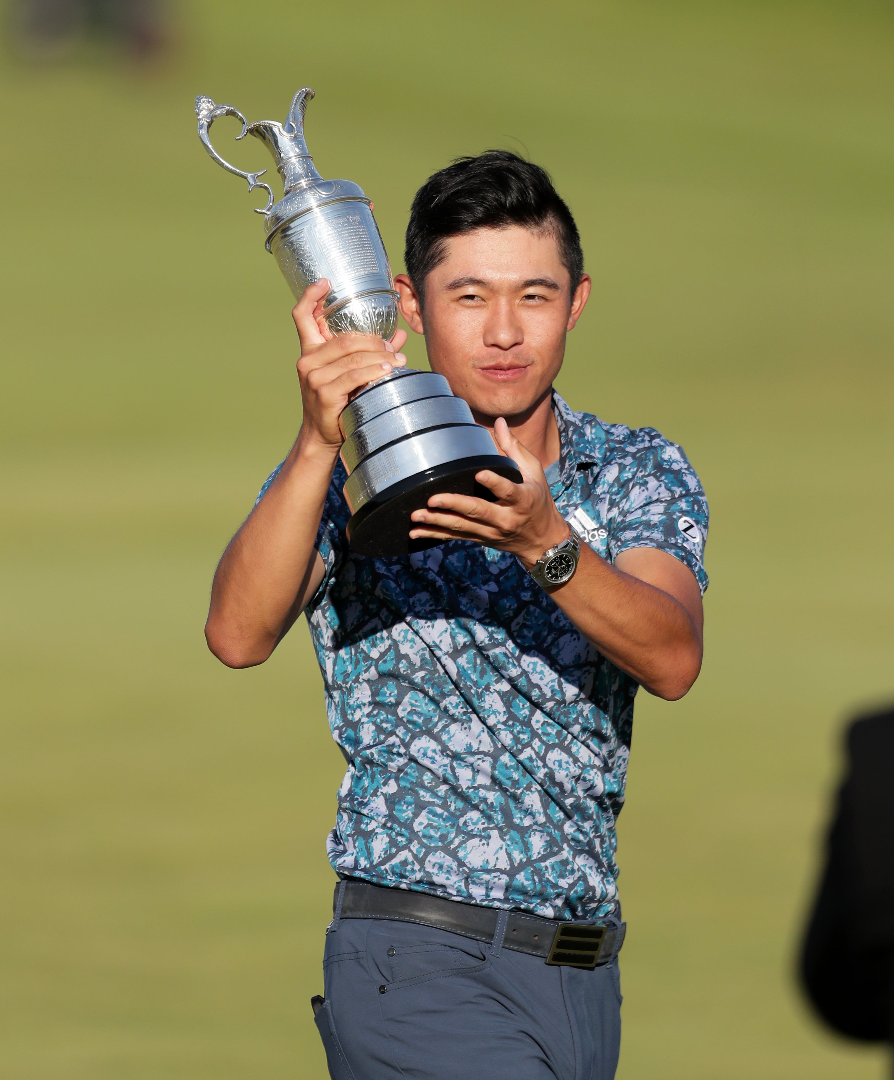 Collin Morikawa lifts the Claret Jug after winning The Open Championship