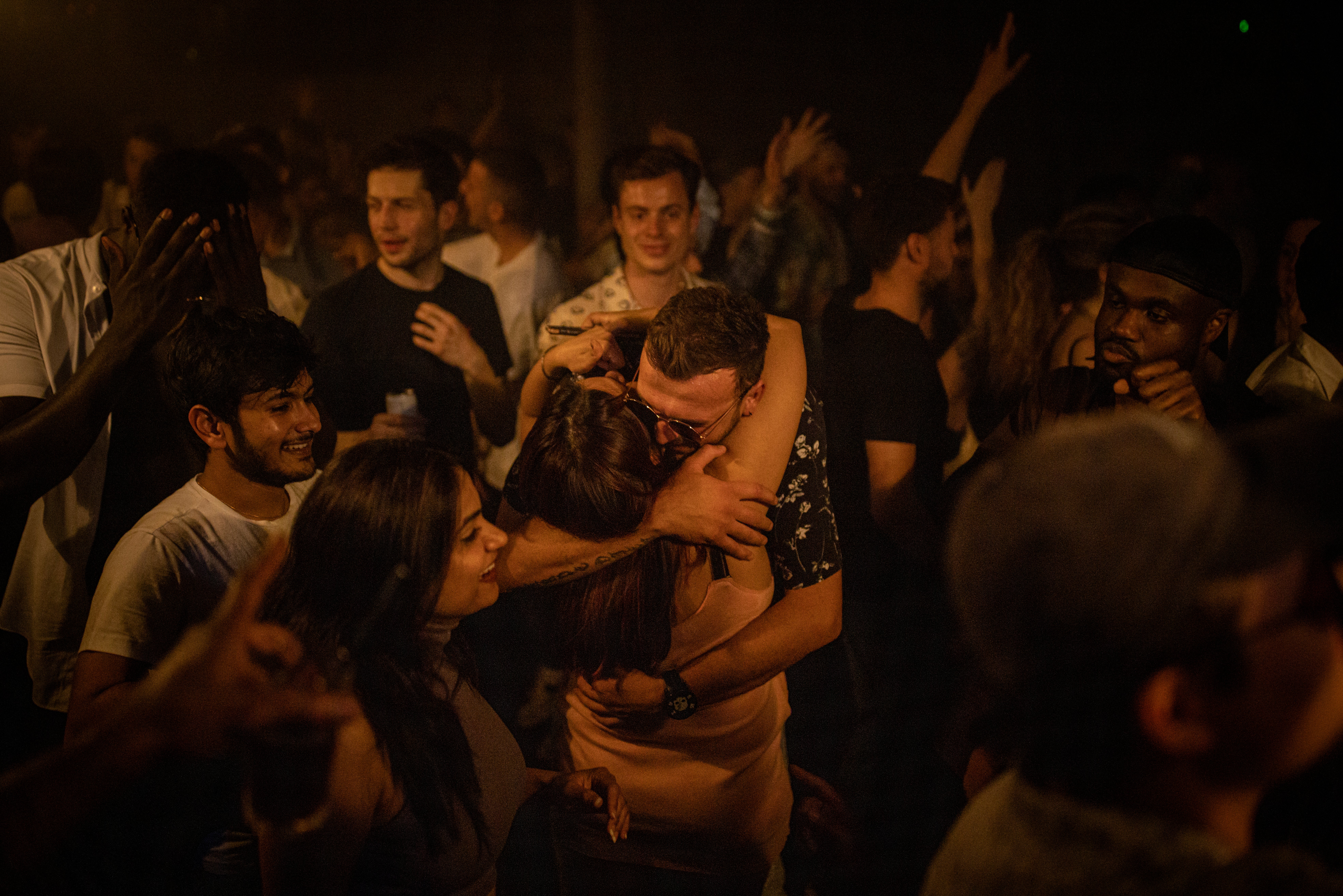 Two people hug in the middle of the dancefloor at Egg London on ‘freedom day’