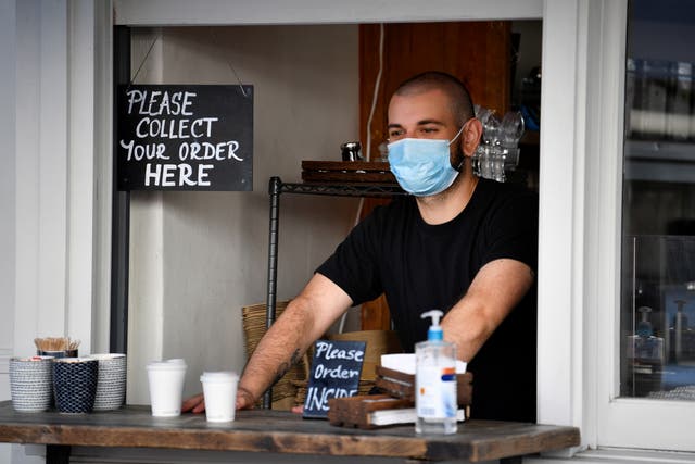 <p>A man wears a face mask in London</p>