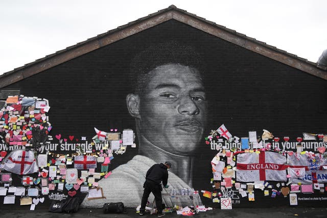 <p>The Marcus Rashford mural is repaired after being defaced by vandals</p>
