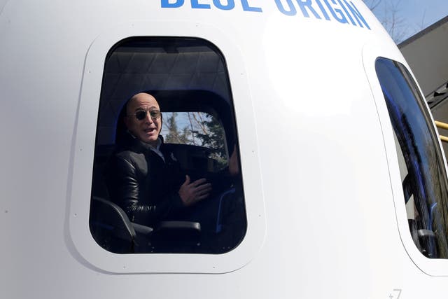 <p>Jeff Bezos addresses the media from inside Blue Origin</p>