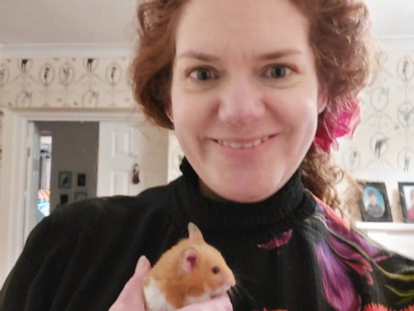 Holly Winter, 42, with her hamster Coda