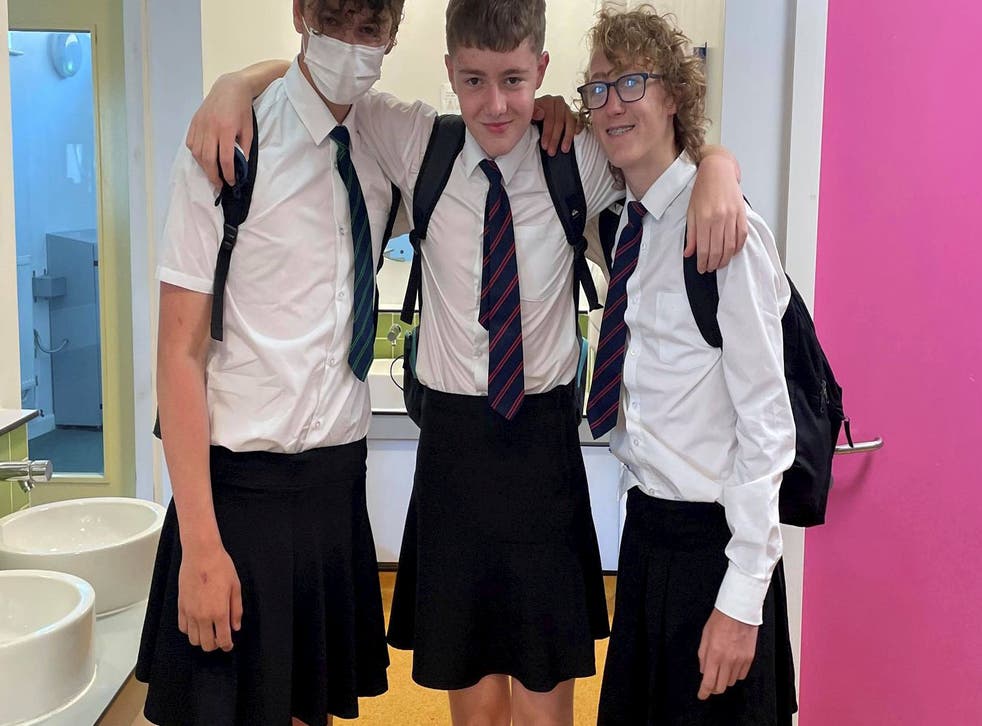 <p>Adrian Copp (centre) and friends at Poltair School in Cornwall in their “cooler” skirts</p>