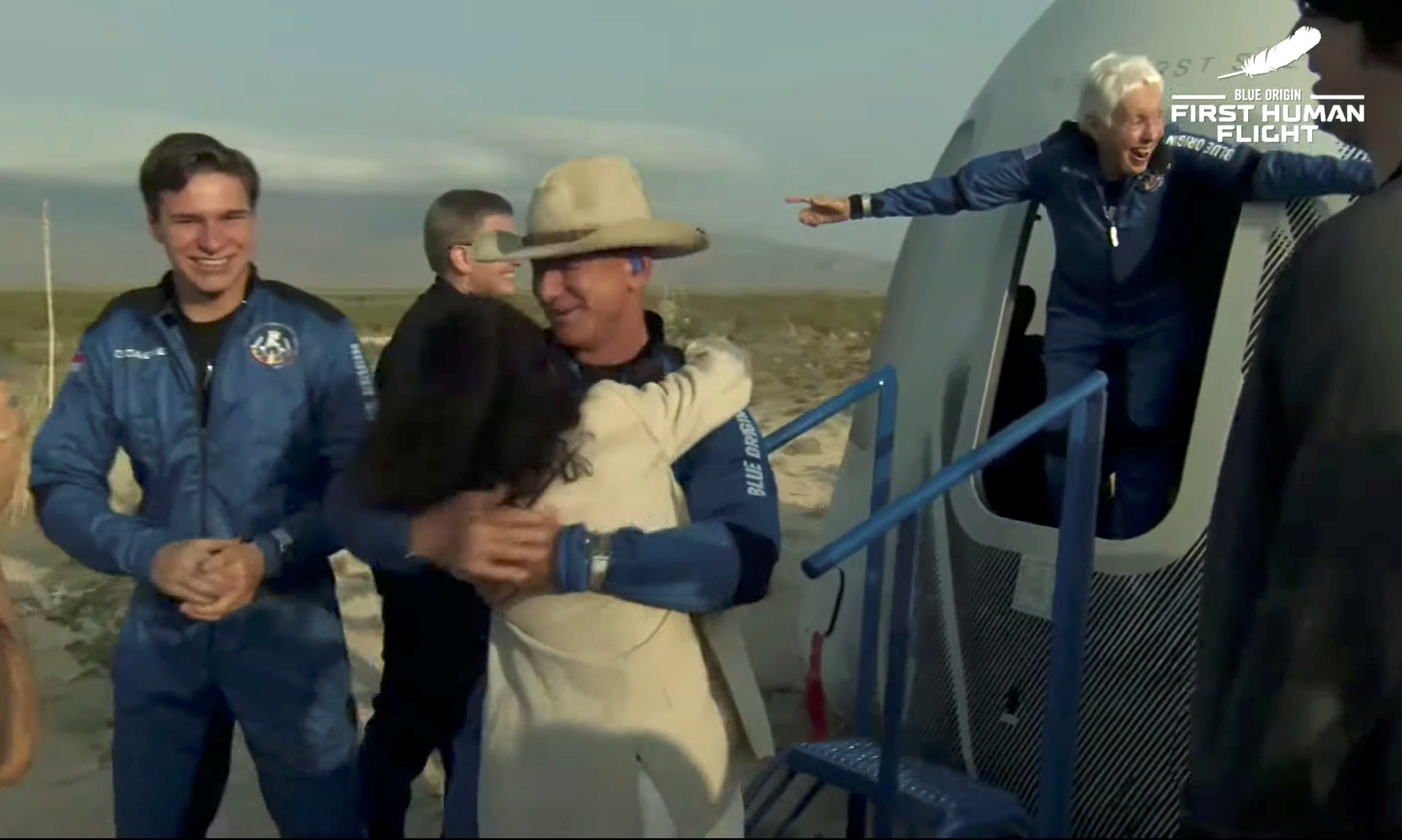 <p>Billionaire businessman Jeff Bezos, recent Dutch high school graduate Oliver Daemen and pioneering female aviator Wally Funk emerge from their capsule after their flight aboard Blue Origin's New Shepard rocket on the world's first unpiloted suborbital flight near Van Horn, Texas</p>