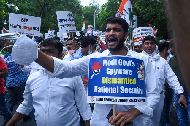 <p>File: India’s Congress party workers take part in a demonstration against the BJP government and  PM Narendra Modi to protest an alleged surveillance operation using the Pegasus spyware in July 2021 </p>