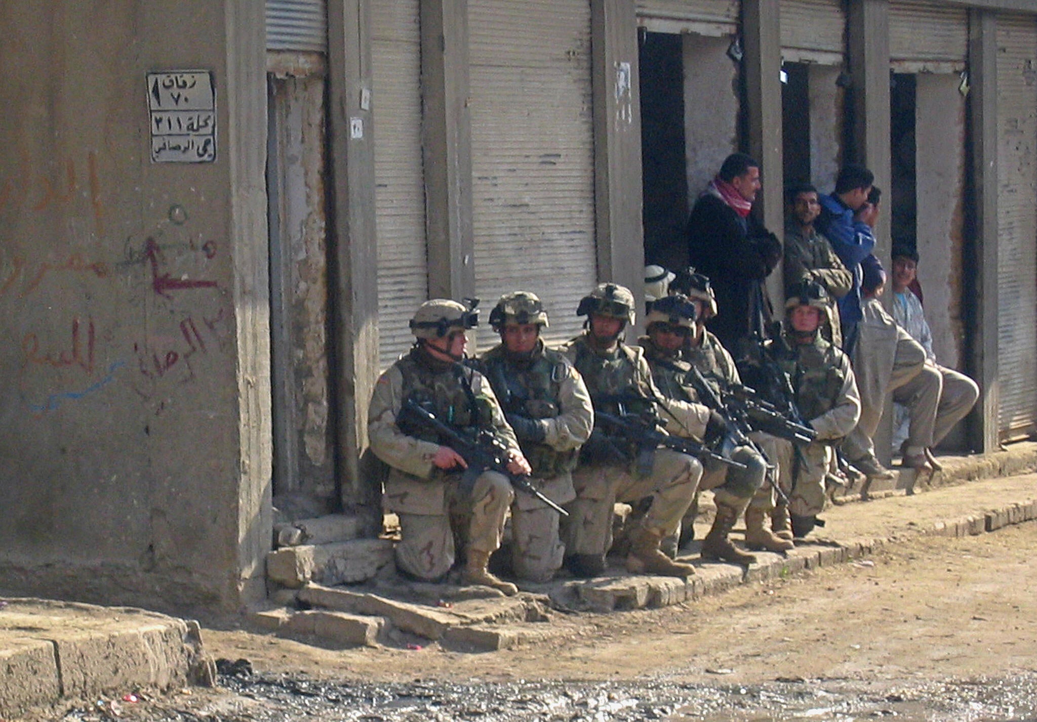 US soldiers raid a neighbourhood in the flashpoint Iraqi town of Fallujah, on 2 January 2004