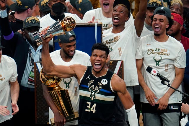 <p>Milwaukee Bucks forward Giannis Antetokounmpo (34) holds the finals MVP trophy after the Bucks defeated the Phoenix Suns in Game 6 of basketball’s NBA Finals</p>