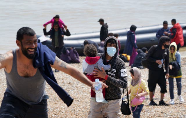 <p>Migrants arriving in Dungeness, Kent, on a small boat from France in 2021 </p>