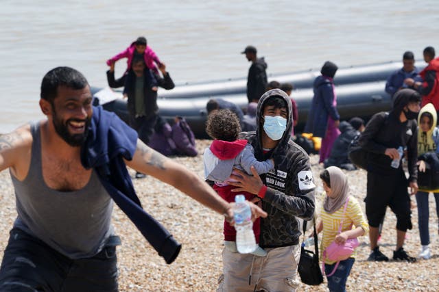 <p>Migrants arriving in Dungeness, Kent, on a small boat from France in 2021 </p>
