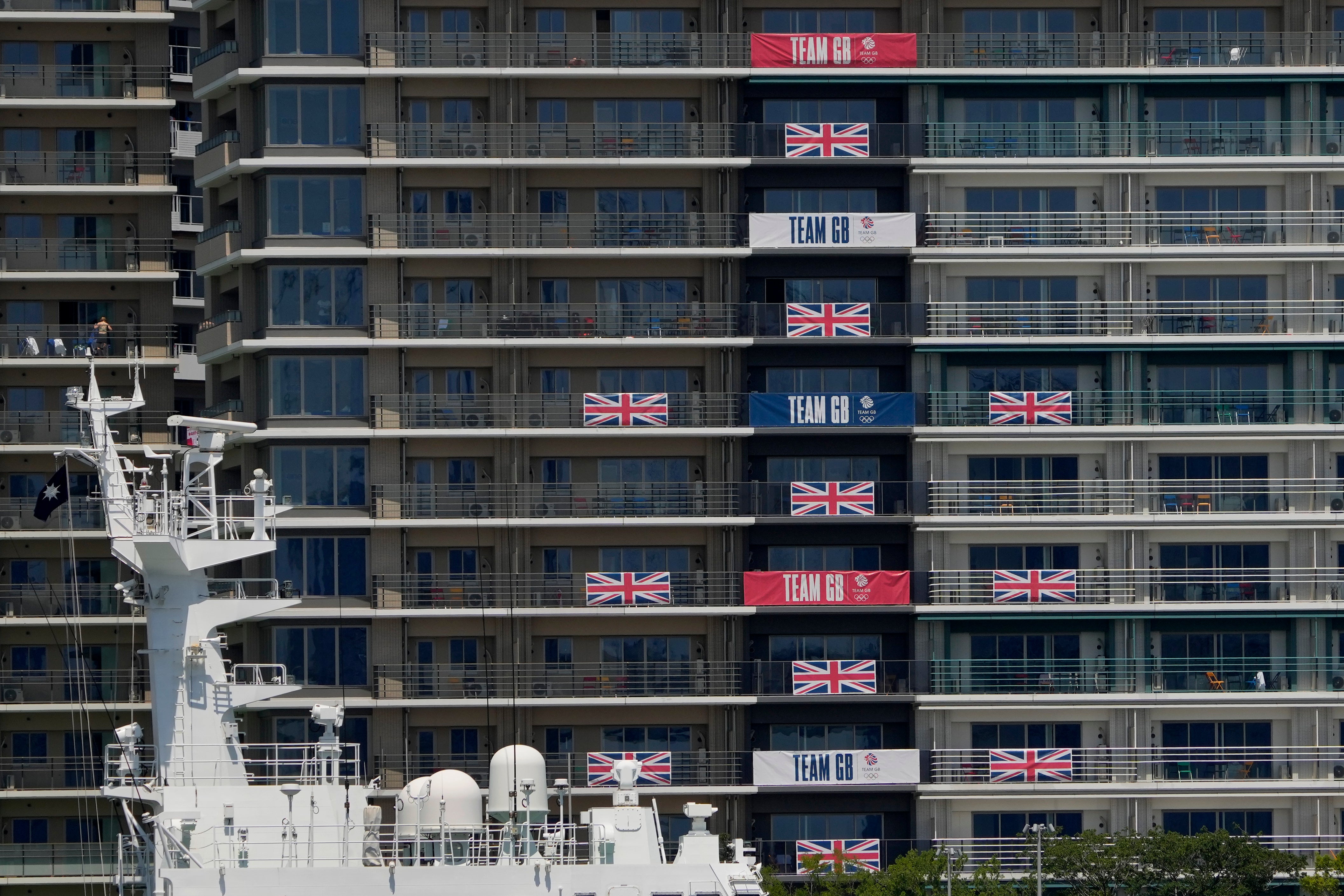 Flags and banners hang from Great Britain team apartments in the Olympic Village