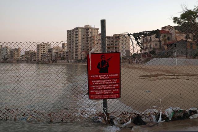 <p>A Turkish army sign is pictured in the fenced-off area of Varosha on the divided Mediterranean island of Cyprus</p>