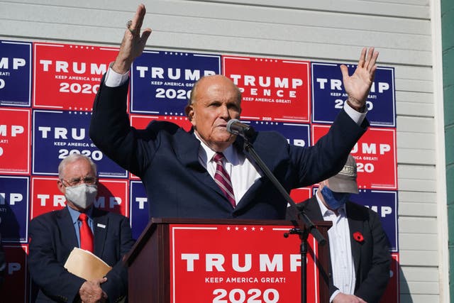 <p> Rudy Giuliani, speaks at a news conference in the parking lot of a landscaping company in Philadelphia in November 2020</p>