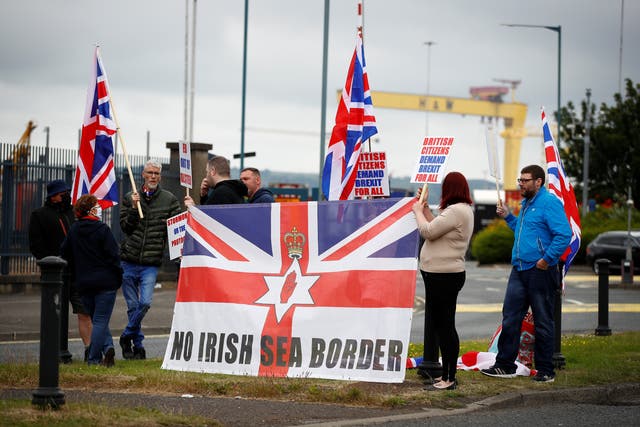 <p>Loyalists protest against the Northern Ireland Brexit protocol at Belfast Harbour Estate</p>