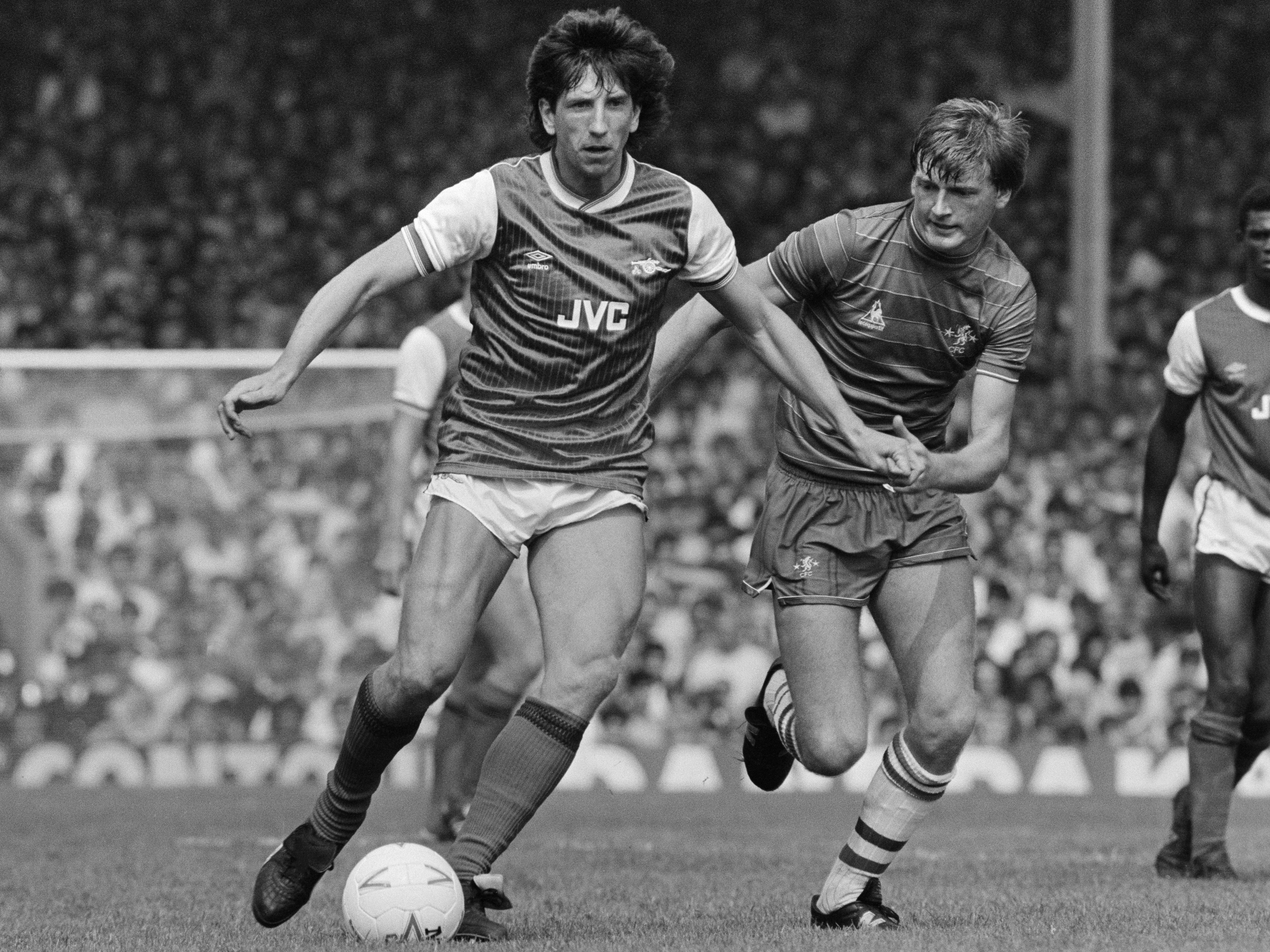 Holding off Chelsea’s Nigel Spackman during a London derby at Highbury in 1984