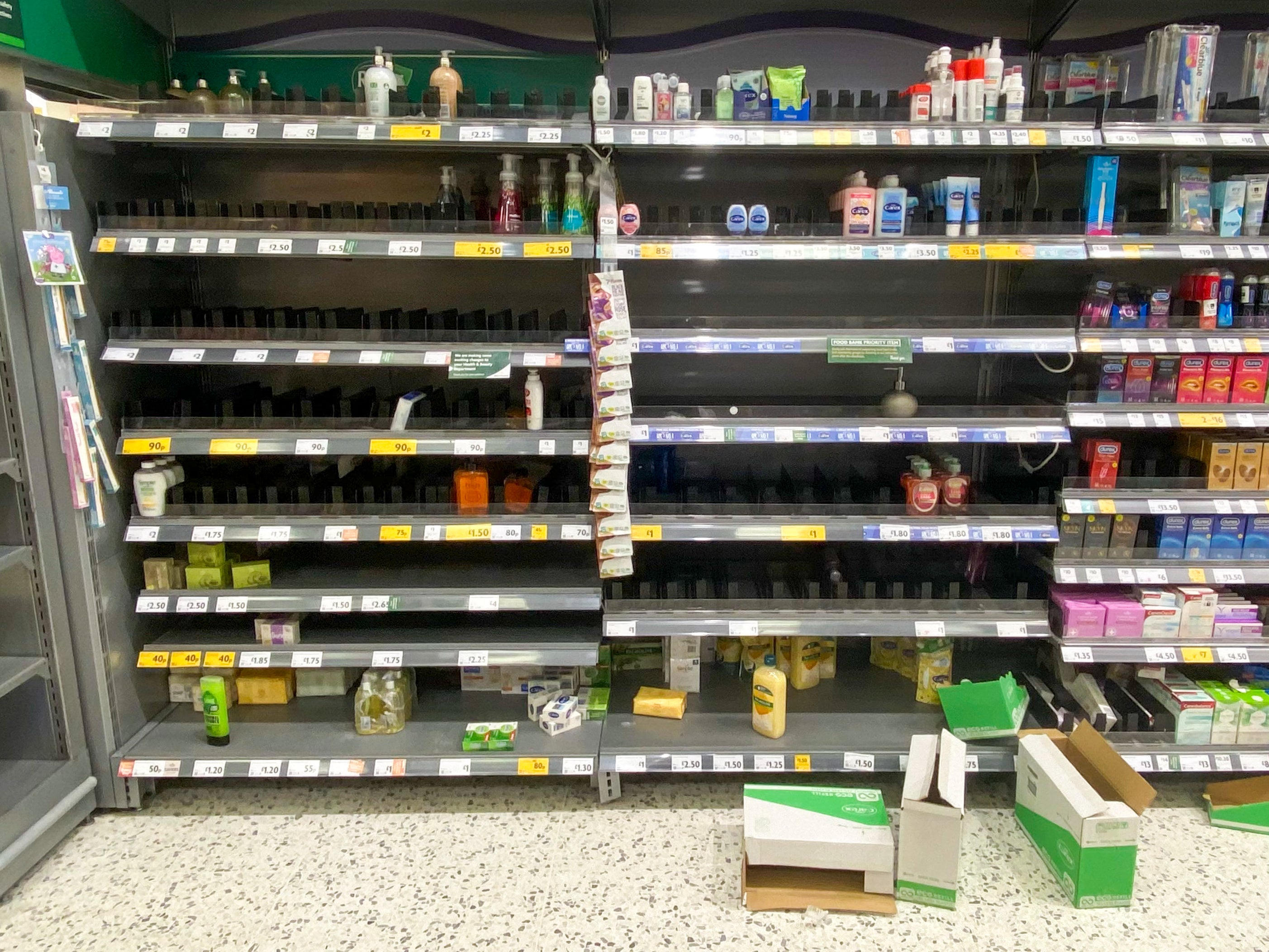 Cleaned out: hand sanitiser shelves almost empty at Morrisons at The Gyle, Edinburgh
