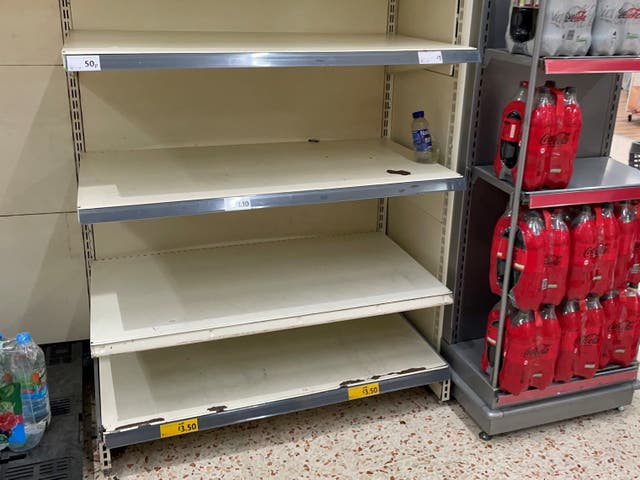 <p>Empty shelves at Morrisons in BelleVale, Liverpool</p>