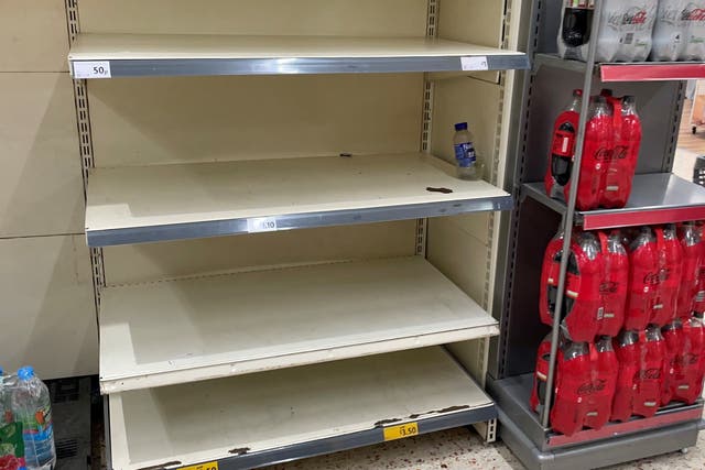 <p>Empty shelves at Morrisons in BelleVale, Liverpool. Deliveries to supermarkets and other businesses across the UK are facing a growing shortage of drivers with many self-isolating</p>