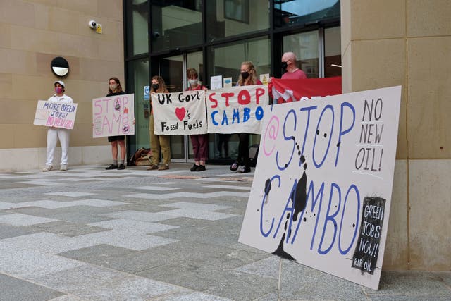 <p>Climate change activists blocked the entrance to a new UK Government hub in Edinburgh to protest against the Cambo oil field’s approval</p>