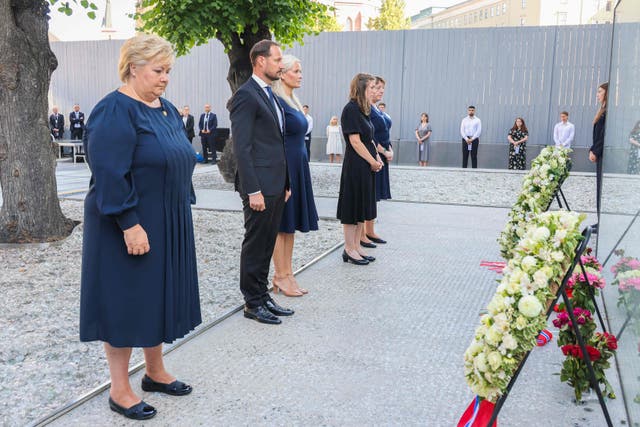 <p>(L-R) Norway's Prime Minister Erna Solberg, Crown Prince Haakon Magnus, Crown Princess Mette-Marit, Utoya massacre survivor Astrid Eide Hoem and the leader of the National Support Group Lisbeth Kristine Royneland attend a wreath-laying ceremony during the memorial service in the Government Quarter in Oslo</p>