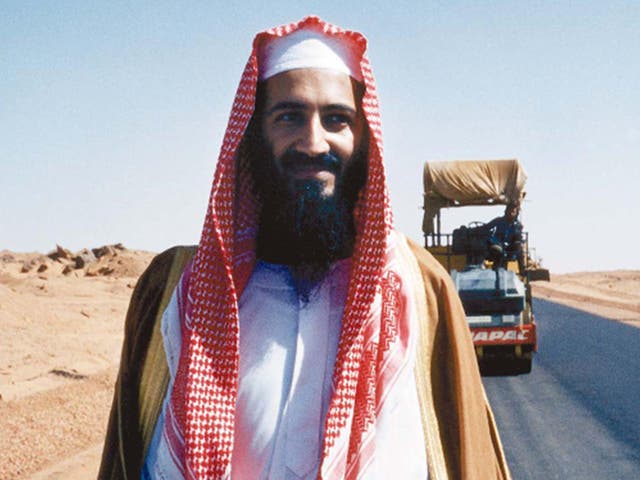 <p>Bin Laden poses by his new desert road, Sudan, 1993</p>
