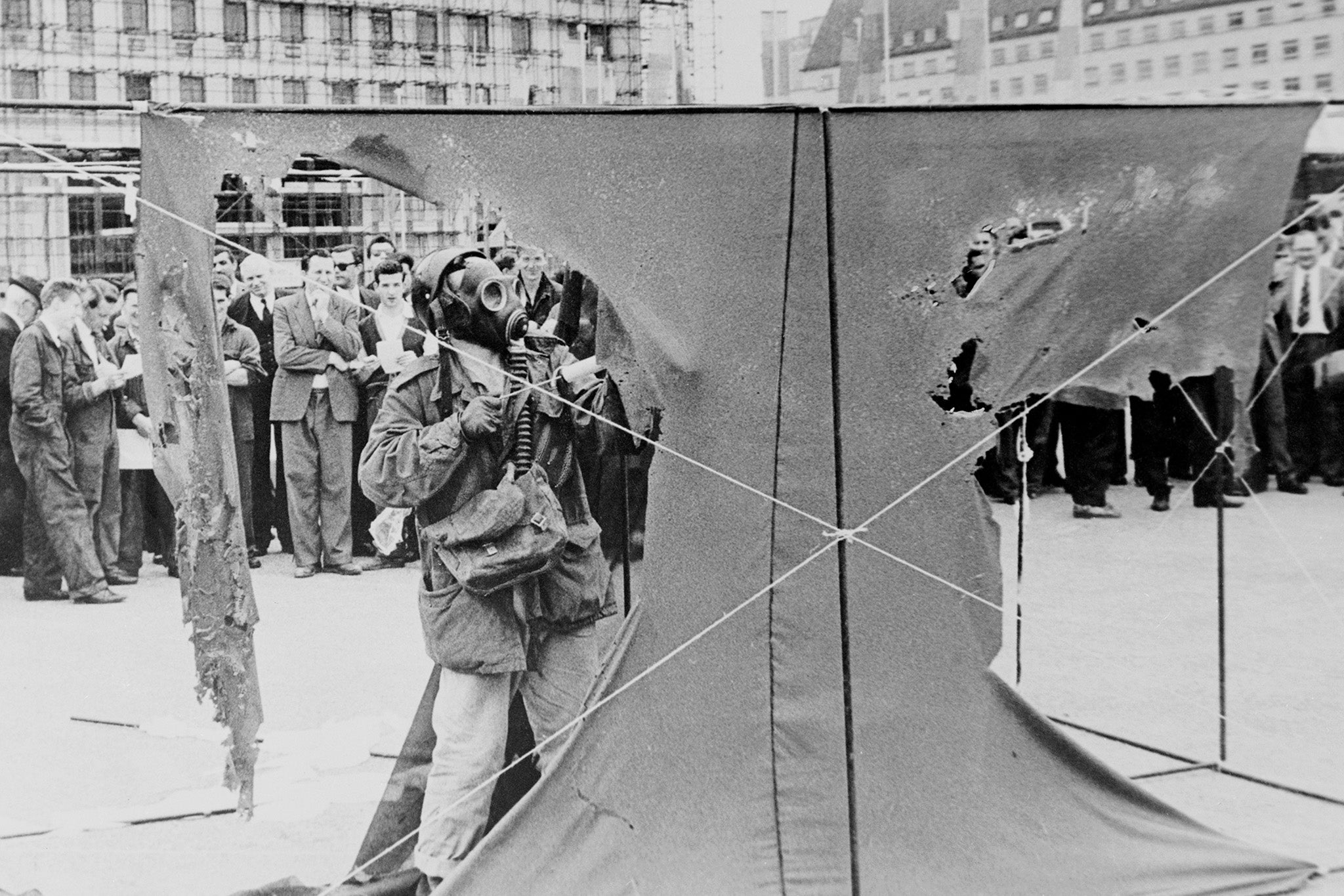 Metzger demonstrates his auto-destructive art at the South Bank, London, in 1961. He sprays hydrochloric acid on three nylon sheets, which begin to disintegrate after a few seconds, and are completely dissolved after 20 minutes