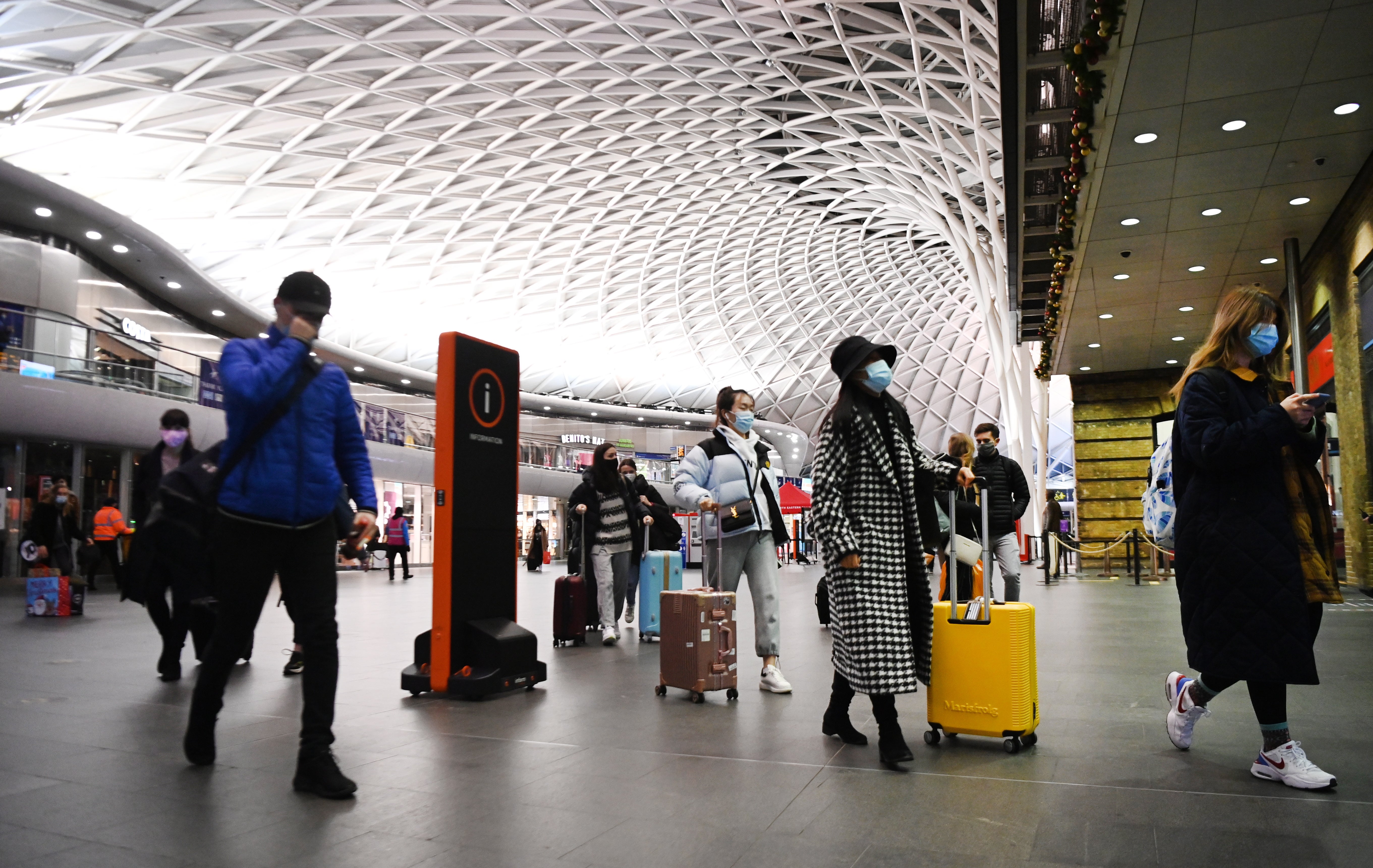 People at Kings Cross train station in London in December 2020 [stock photo]