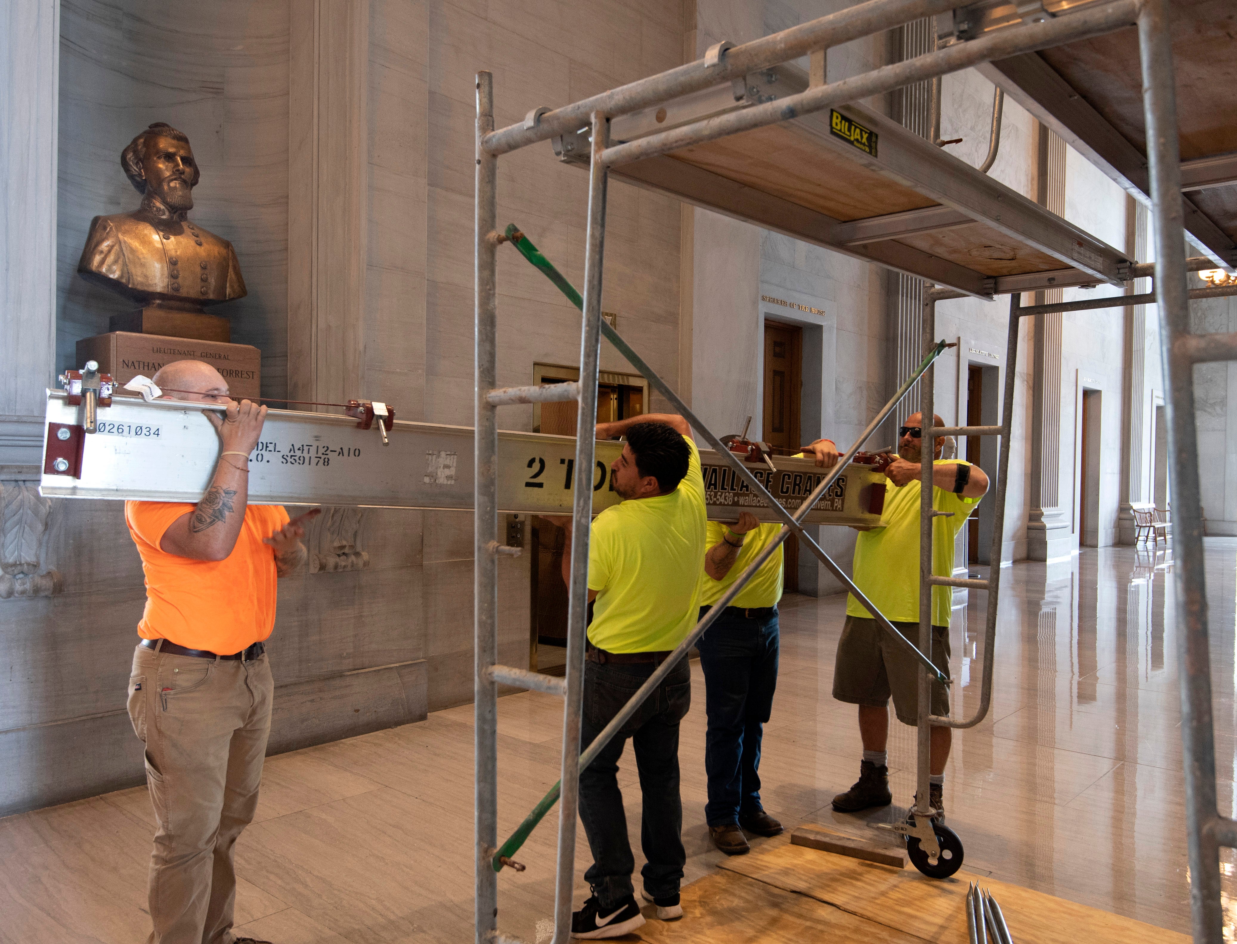 Workers prepare scaffolding in front of a bust of Confederate General and early Ku Klux Klan leader Nathan Bedford Forrest at the State Capitol Thursday, 22 July 2021 in Nashville, Tennessee.