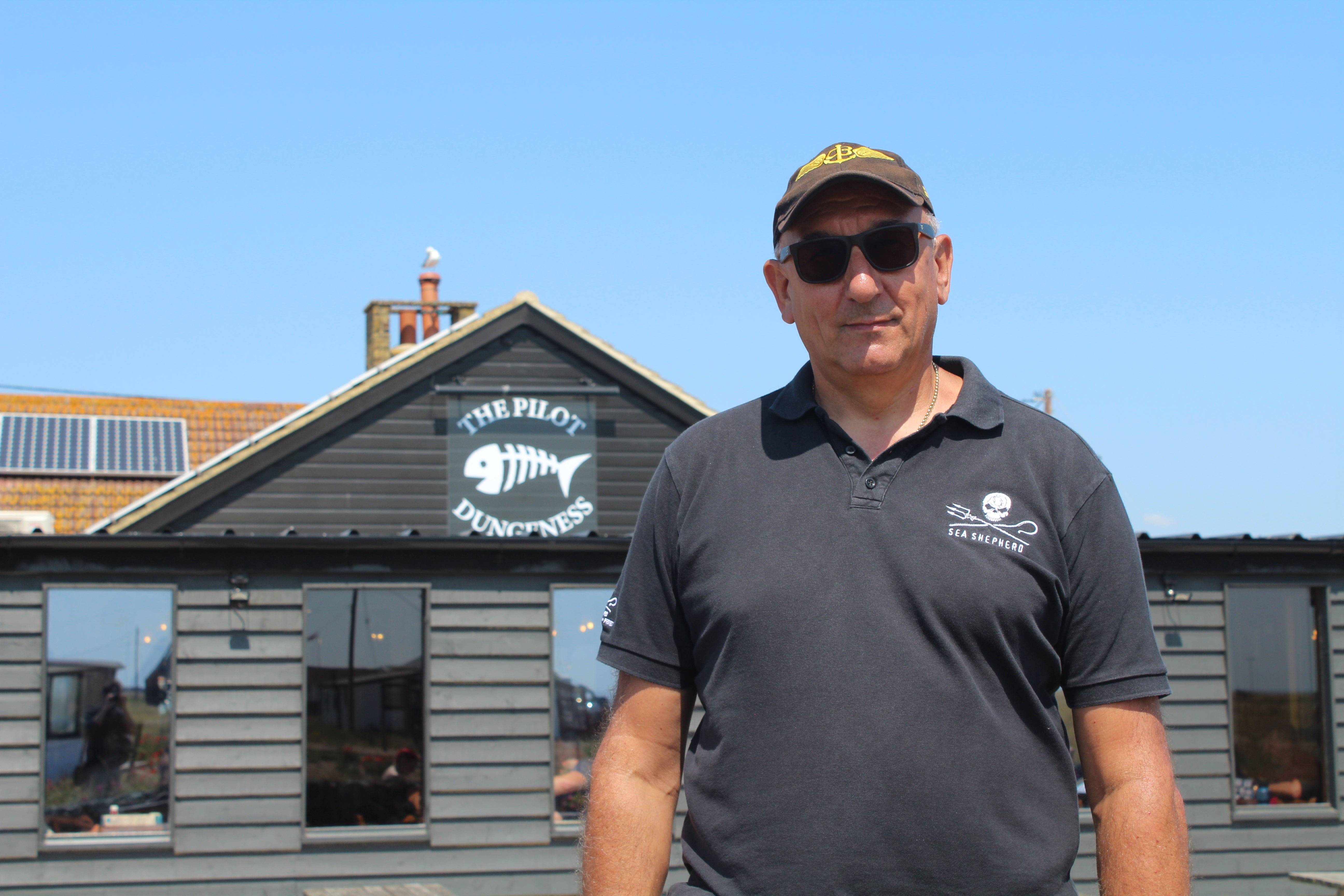 Niko Miaoulis in front of the pub he owns in Dungeness