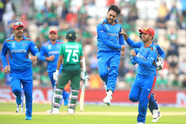 <p>Rashid Khan celebrates taking a wicket for Afghanistan (Adam Davy/PA)</p>