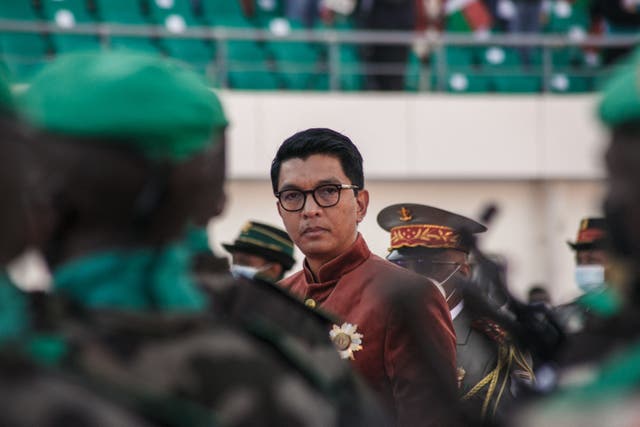 <p>Madagascar's President Andry Rajoelina inspects troops</p>